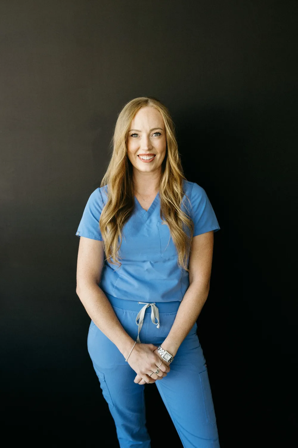 Madisen in blue scrubs